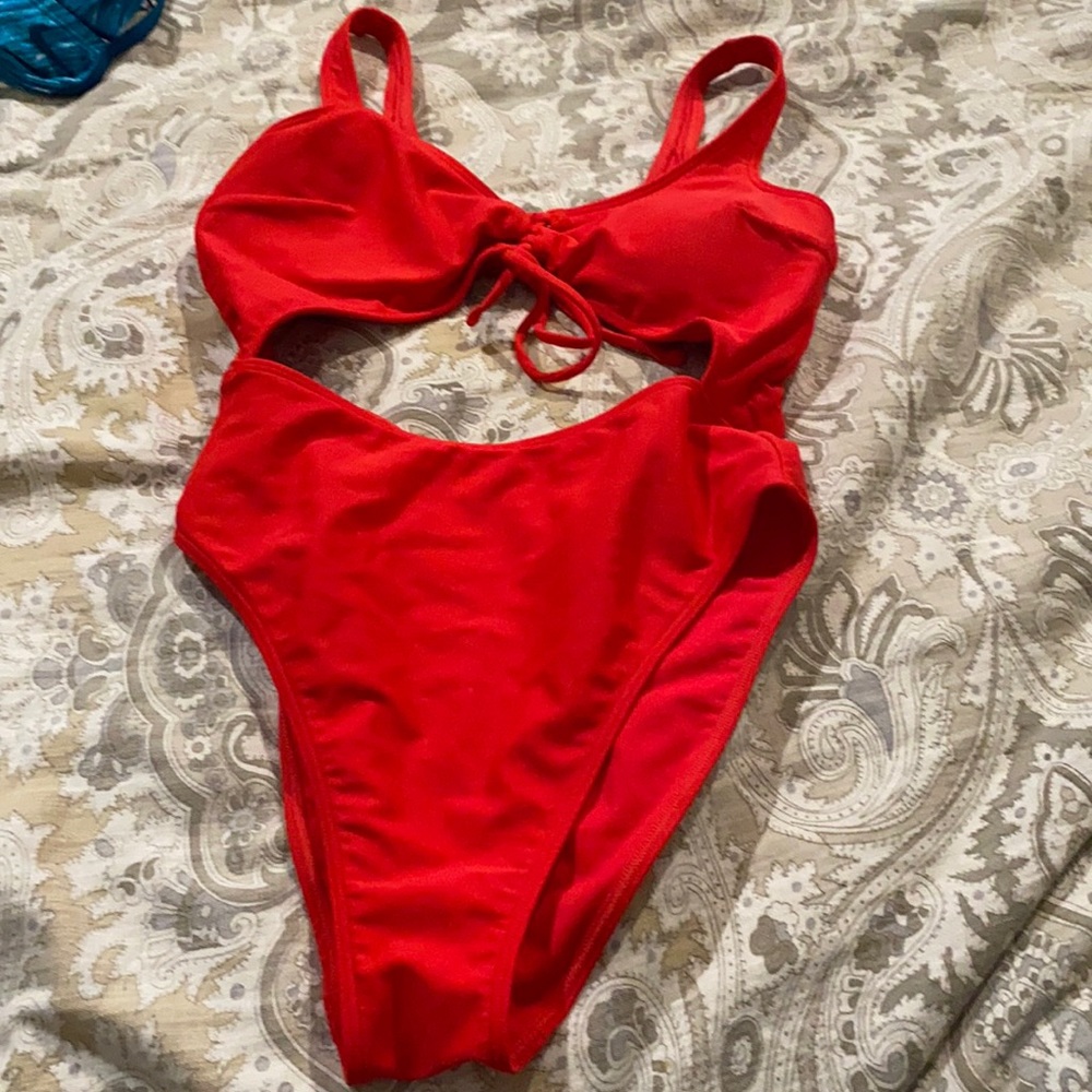 red cut out one piece never worn